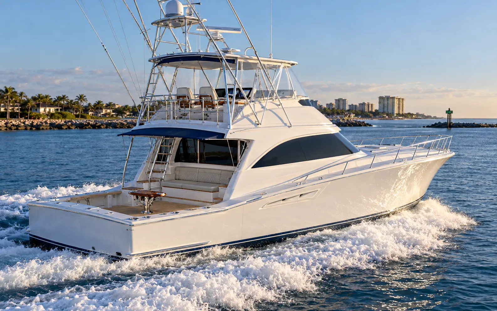 High-end 74-foot convertible sportfishing yacht underway with a tournament cockpit, mezzanine upholstery, tower, and luxury profile