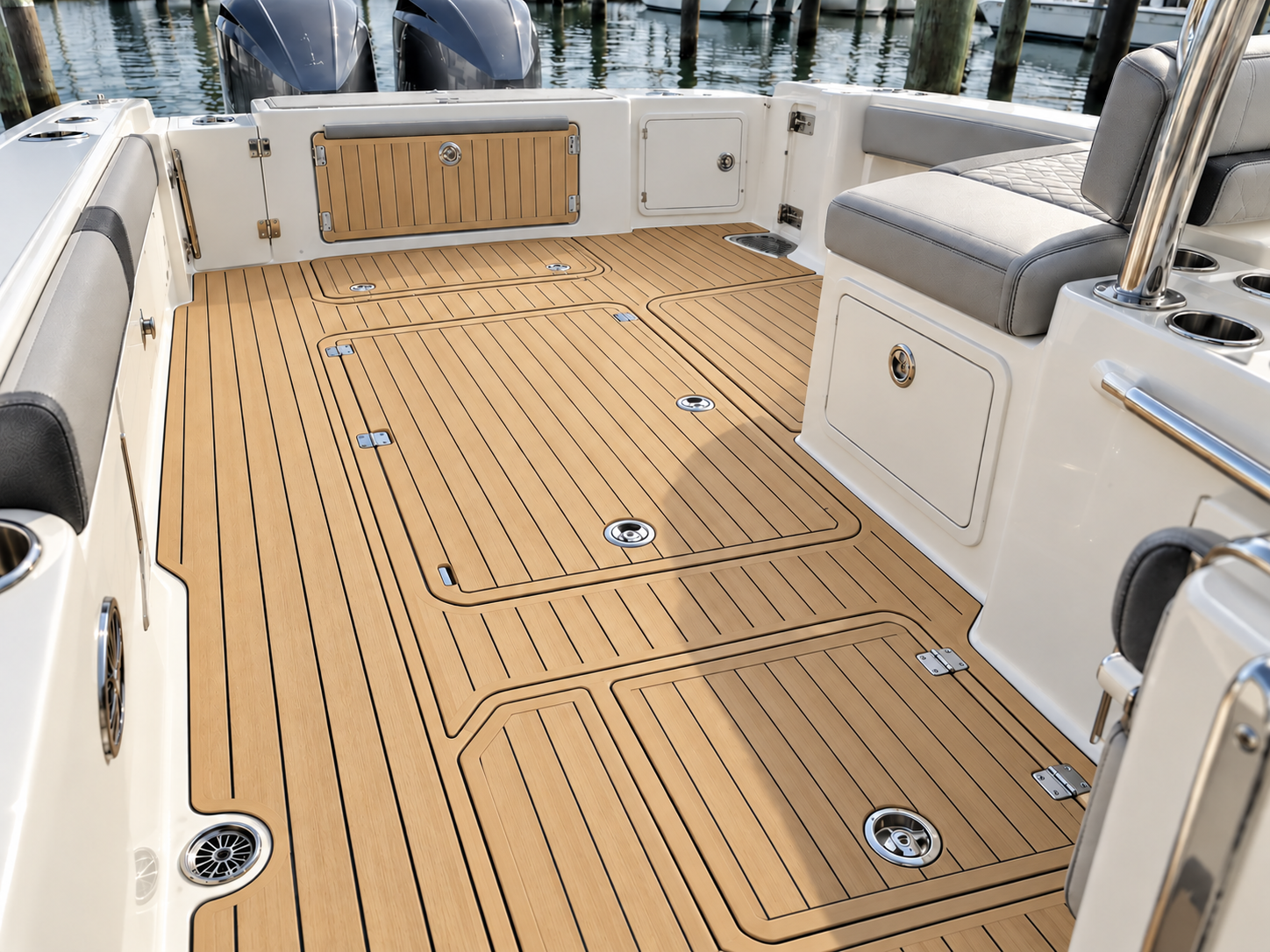 Center-console cockpit finished entirely in professionally fitted Flexiteek decking with narrow dark caulking and aligned hatch panels