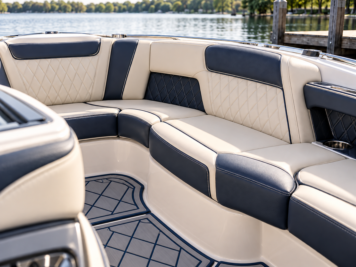 Cream and navy diamond-stitched luxury marine upholstery above fitted storm-gray and navy layered EVA foam SeaDek flooring